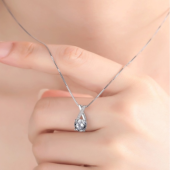 Sterling Silver Criss-Cross Stunning Simulated Diamond Silver Pendant Necklace - Picture 5 of 10